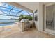 Outdoor kitchen, conveniently located next to the screened-in pool, perfect for outdoor dining and entertaining at 17610 Polo Trl, Bradenton, FL 34211