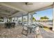 Inviting outdoor patio area with comfortable seating, perfect for relaxing or entertaining near the community pool at 17610 Polo Trl, Bradenton, FL 34211