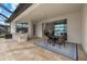 Relaxing outdoor patio with a built-in grill, dining area, and views of the pool at 17610 Polo Trl, Bradenton, FL 34211