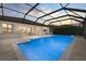 Sparkling pool and outdoor seating area with a scenic water view at sunset at 17610 Polo Trl, Bradenton, FL 34211