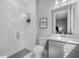 A contemporary bathroom with a glass-enclosed shower, modern vanity, and clean, bright finishes at 17814 Cresswind Ter, Bradenton, FL 34211