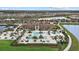 Aerial view of community pool, clubhouse and manicured landscaping, a great place to spend time outdoors at 17814 Cresswind Ter, Bradenton, FL 34211