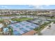 Aerial view of the neighborhood showing the pickleball and tennis courts with waterfront homes at 17814 Cresswind Ter, Bradenton, FL 34211