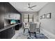 Modern dining room featuring a glass table, gray chairs, custom cabinetry, and an accent rug at 17814 Cresswind Ter, Bradenton, FL 34211