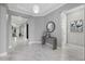 Bright foyer with marble floors, modern decor, and a view of the open-concept living space at 17814 Cresswind Ter, Bradenton, FL 34211