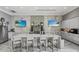Gourmet kitchen with marble countertops, stainless steel appliances, and a large island with seating at 17814 Cresswind Ter, Bradenton, FL 34211