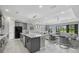 Open-concept kitchen featuring a large island, modern appliances, and a seamless transition to the living area at 17814 Cresswind Ter, Bradenton, FL 34211