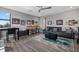 This versatile living room features a desk, cozy sofa, and sports memorabilia creating a comfortable atmosphere at 17814 Cresswind Ter, Bradenton, FL 34211