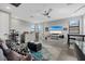 Relaxing living area with contemporary furniture, neutral colors, and natural light streaming through the windows at 17814 Cresswind Ter, Bradenton, FL 34211