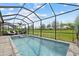 A beautiful screened-in pool and spa offer a private backyard oasis with lush green landscaping at 17814 Cresswind Ter, Bradenton, FL 34211