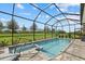 Screened-in pool featuring a spa and backyard views at 17814 Cresswind Ter, Bradenton, FL 34211