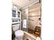 Bathroom featuring tiled shower with a glass door, and a built in cabinet at 2057 Sunset Dr # G1, Bradenton, FL 34207