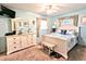 Bedroom featuring light blue walls and nautical-themed bedding and decor at 2057 Sunset Dr # G1, Bradenton, FL 34207