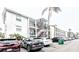 Exterior view of building featuring multiple floors, a stairwell, balcony and plenty of parking at 2057 Sunset Dr # G1, Bradenton, FL 34207