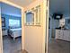 Hallway view into the bedroom, showing decor and style at 2057 Sunset Dr # G1, Bradenton, FL 34207