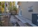 Cozy backyard area featuring a small patio, wooden fence, and easy access through the French doors at 2219 12Th W Ave, Bradenton, FL 34205