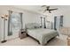 Bedroom with large windows, ceiling fan, and neutral decor at 2219 12Th W Ave, Bradenton, FL 34205