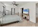 Bedroom has carpet flooring, a sliding closet door, and a flatscreen tv at 2219 12Th W Ave, Bradenton, FL 34205