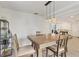 Dining room showing modern hanging lights over the table with bar and drink display at 2219 12Th W Ave, Bradenton, FL 34205