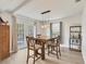 Dining room with a modern light fixture and french doors leading to the backyard at 2219 12Th W Ave, Bradenton, FL 34205