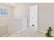 Upstairs hallway showing bedroom door, with carpet flooring at 2219 12Th W Ave, Bradenton, FL 34205