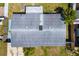 A high-angle view shows the roof and yard at 2406 25Th W Ave, Bradenton, FL 34205