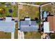 An aerial view shows the property's layout with the fenced backyard, other homes nearby, and streets at 2406 25Th W Ave, Bradenton, FL 34205