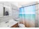 Bright bathroom with updated fixtures, a modern vanity, and a shower with decorative curtain at 2406 25Th W Ave, Bradenton, FL 34205