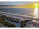 A beautiful beach with a sunset on the horizon at 2406 25Th W Ave, Bradenton, FL 34205