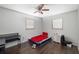 Comfortable bedroom with two windows and a ceiling fan at 2406 25Th W Ave, Bradenton, FL 34205