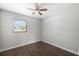 Inviting bedroom with hardwood floors, a window and a ceiling fan at 2406 25Th W Ave, Bradenton, FL 34205