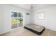 Bright bedroom with sliding glass door to the yard and neutral decor at 2406 25Th W Ave, Bradenton, FL 34205