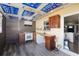 This kitchenette features wood cabinets, laminate flooring, and modern appliances at 2406 25Th W Ave, Bradenton, FL 34205