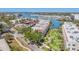 Expansive aerial view of the property and surrounding marina showcasing waterfront community and manicured landscaping at 250 Santa Maria St # 215, Venice, FL 34285