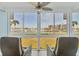 Stunning marina view from the unit with sliding windows and comfortable chairs at 250 Santa Maria St # 215, Venice, FL 34285