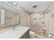 Updated bathroom with a large shower featuring decorative tile and a built-in bench, plus updated vanity at 250 Santa Maria St # 215, Venice, FL 34285