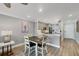 View from dining area to kitchen with stainless appliances and hardware at 250 Santa Maria St # 215, Venice, FL 34285