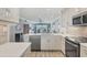 Bright, open kitchen overlooking the living area and beautiful water views at 250 Santa Maria St # 215, Venice, FL 34285