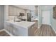 Well-lit kitchen showcasing quartz countertops and stainless-steel appliances at 250 Santa Maria St # 215, Venice, FL 34285