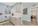 Stylish kitchen with updated cabinets and stainless appliances, next to bedroom and hallway at 250 Santa Maria St # 215, Venice, FL 34285