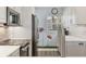 Close-up of a kitchen featuring updated appliances and a convenient breakfast bar at 250 Santa Maria St # 215, Venice, FL 34285