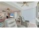 Open living space with a ceiling fan, two recliner chairs, and beautiful marina view at 250 Santa Maria St # 215, Venice, FL 34285