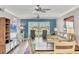 Spacious living area featuring bright marina views, ceiling fans, and beach-themed décor at 250 Santa Maria St # 215, Venice, FL 34285