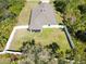 Aerial showcasing the manicured lawn, the fence for privacy, and the screened porch for relaxation at 2721 Burri Ter, North Port, FL 34288