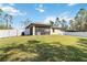 A large backyard featuring lush green grass, perfect for outdoor recreation and activities at 2721 Burri Ter, North Port, FL 34288