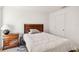 This cozy bedroom features a plush bed, hardwood furniture, and a large window at 2721 Burri Ter, North Port, FL 34288