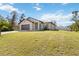 Beautiful single-story home with a manicured lawn and a two-car garage, perfect for a Gathering at 2721 Burri Ter, North Port, FL 34288