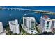 Aerial shot of the property highlighting its prime waterfront location and modern architectural design at 280 Golden Gate Pt # 400, Sarasota, FL 34236