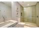 Modern bathroom featuring walk-in shower with sleek glass door, contemporary fixtures, and neutral finishes at 280 Golden Gate Pt # 400, Sarasota, FL 34236