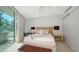 Bright bedroom featuring a large window, desk and seating area at 280 Golden Gate Pt # 400, Sarasota, FL 34236